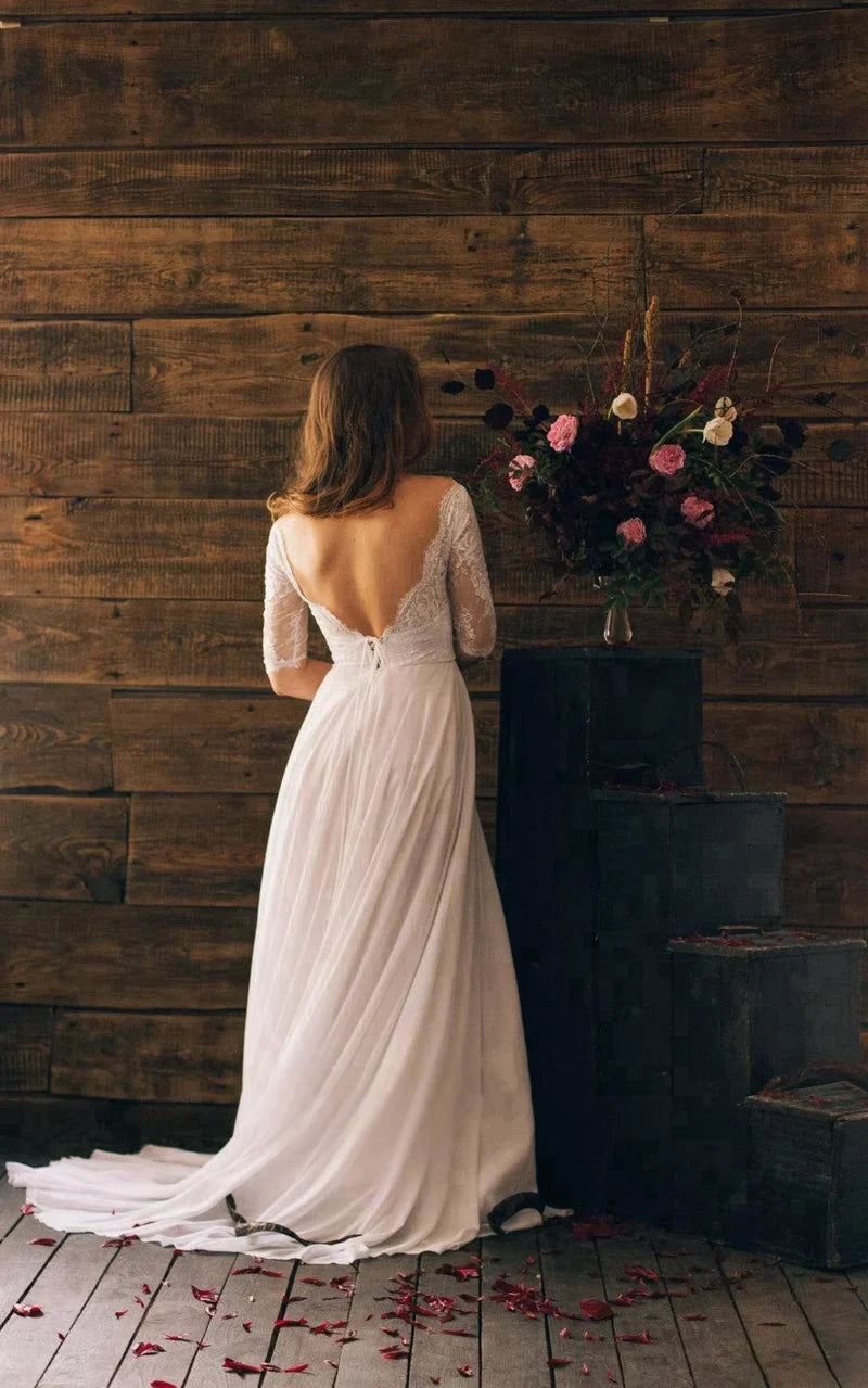 Vestido largo de gasa con mangas 3/4 y escote de encaje en forma de A